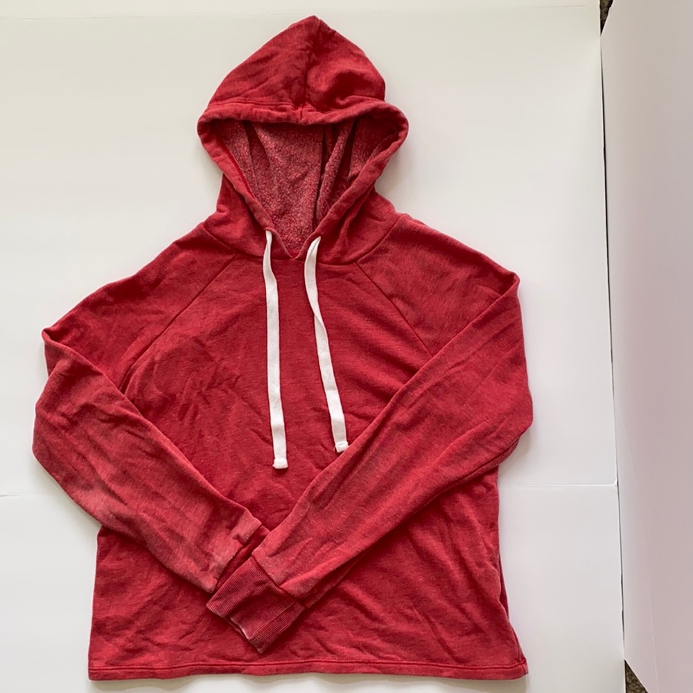 Short and soft red hoodie with white drawstring